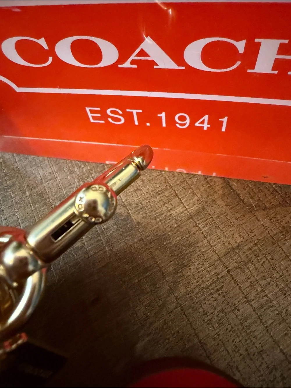 Coach Swivel Apple Charm